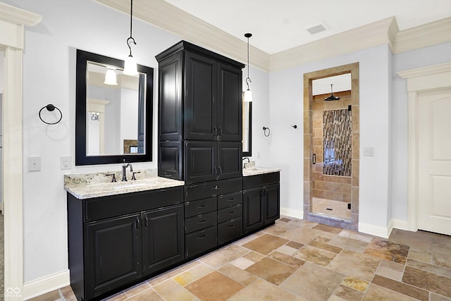 bathroom featuring vanity, an enclosed shower, and ornamental molding