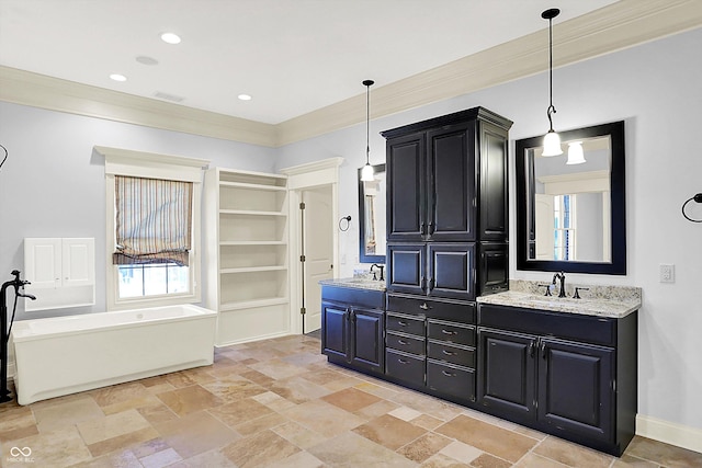 bathroom with vanity and crown molding