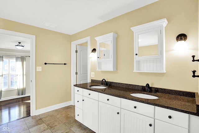 bathroom featuring tile patterned flooring and vanity