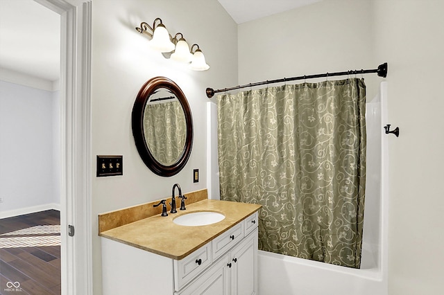 bathroom with vanity and shower / bath combo with shower curtain