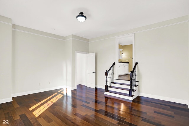 unfurnished room with dark hardwood / wood-style floors