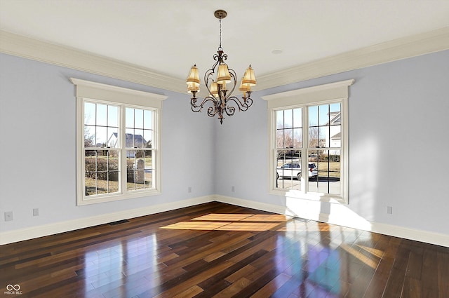 unfurnished dining area with a chandelier, ornamental molding, and dark wood-type flooring