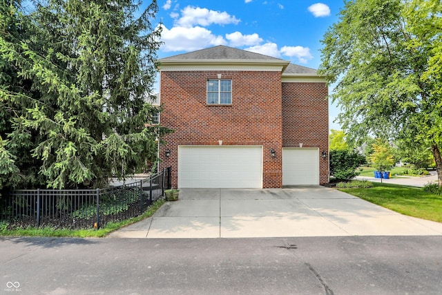 view of side of home featuring a garage