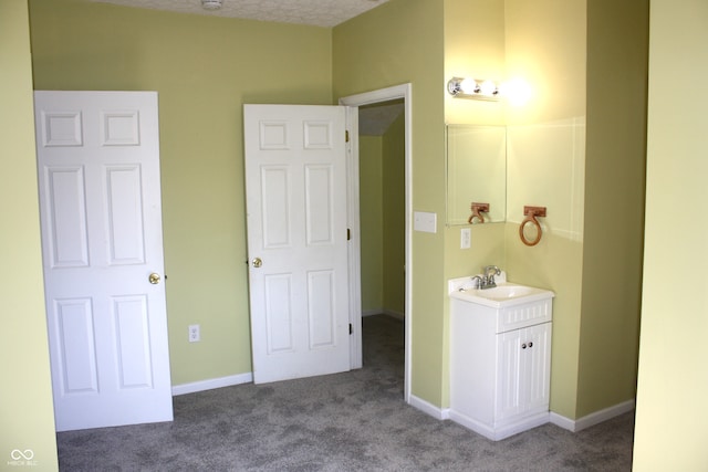 bathroom featuring vanity and a textured ceiling