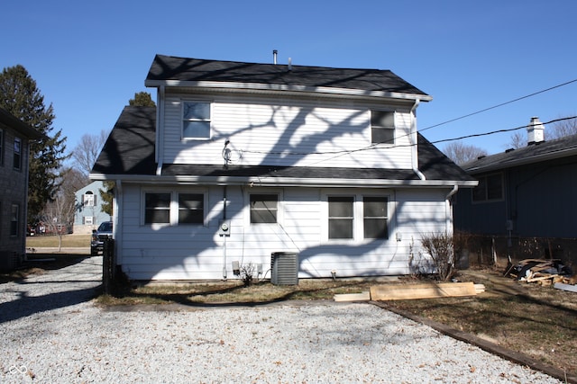 back of property with central AC unit