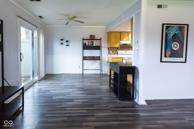 kitchen with dark hardwood / wood-style flooring, tasteful backsplash, ornamental molding, white range, and ceiling fan