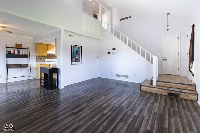 living room featuring crown molding, high vaulted ceiling, dark wood-type flooring, and ceiling fan