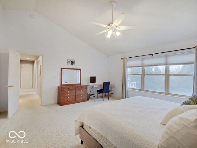 carpeted bedroom with ceiling fan and high vaulted ceiling