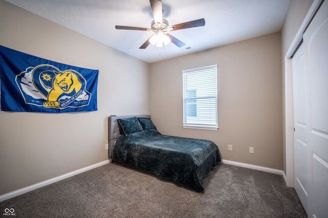 bedroom with carpet flooring, a closet, and ceiling fan