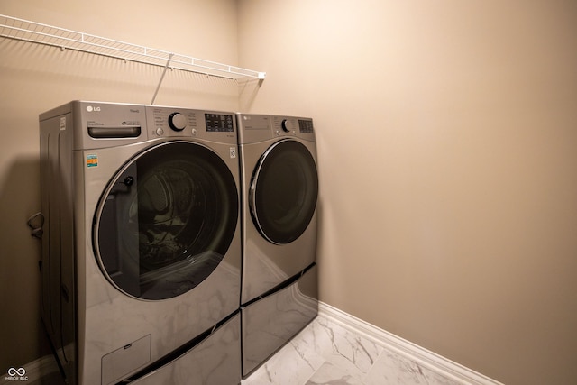 washroom with washing machine and dryer