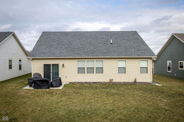 back of house featuring a patio area and a yard