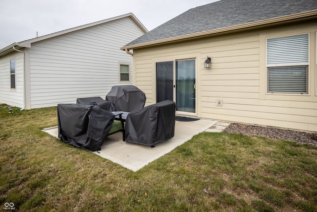 rear view of property featuring a patio area and a yard