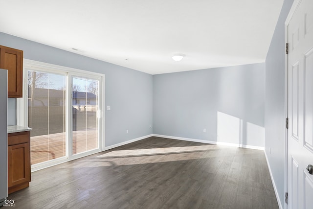 spare room featuring dark hardwood / wood-style flooring