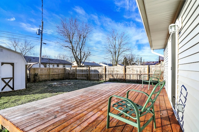 wooden terrace featuring a storage shed