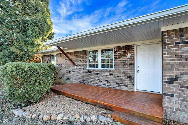 doorway to property with a deck