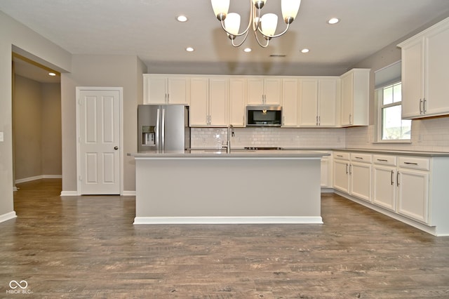 17345 Northam Dr, Westfield, IN 46074 - kitchen with tasteful backsplash, appliances with stainless steel finishes, white cabinets, a notable chandelier, and dark wood-style floors