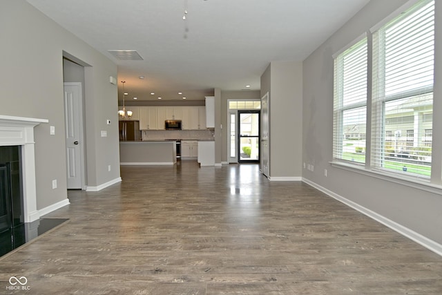 17345 Northam Dr, Westfield, IN 46074 - unfurnished living room with recessed lighting, visible vents, baseboards, and dark wood-style flooring