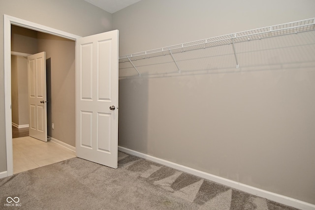 17345 Northam Dr, Westfield, IN 46074 - walk in closet featuring tile patterned floors and carpet flooring