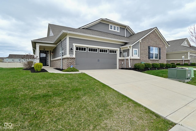 17345 Northam Dr, Westfield, IN 46074 - craftsman house featuring a front lawn, brick siding, driveway, and an attached garage