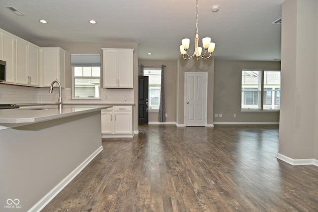 17345 Northam Dr, Westfield, IN 46074 - kitchen with white cabinets, light countertops, backsplash, and dark wood-style flooring