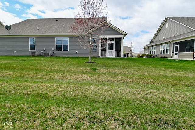 17345 Northam Dr, Westfield, IN 46074 - back of property featuring a lawn, a sunroom, and central air condition unit