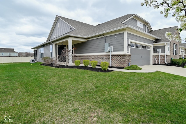 17345 Northam Dr, Westfield, IN 46074 - craftsman-style house featuring fence, driveway, brick siding, a front yard, and a garage