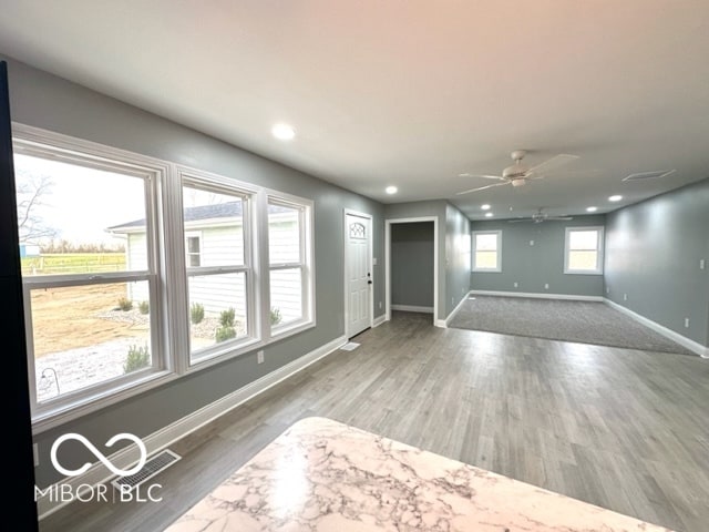 spare room featuring hardwood / wood-style flooring and ceiling fan