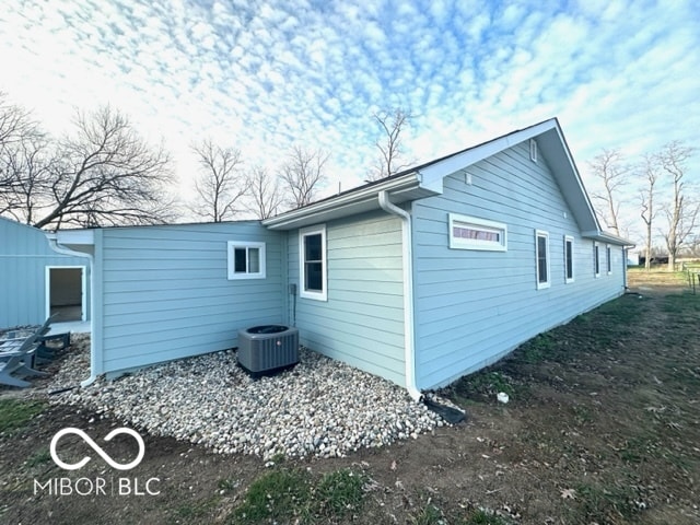 view of home's exterior with central AC unit