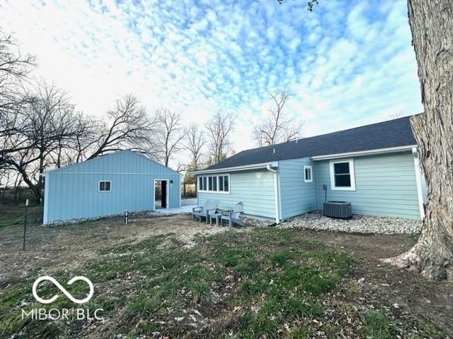 back of property featuring central AC unit