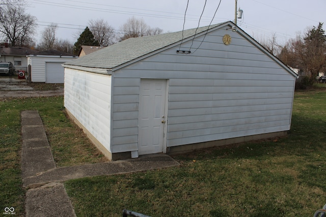 view of outbuilding featuring a yard