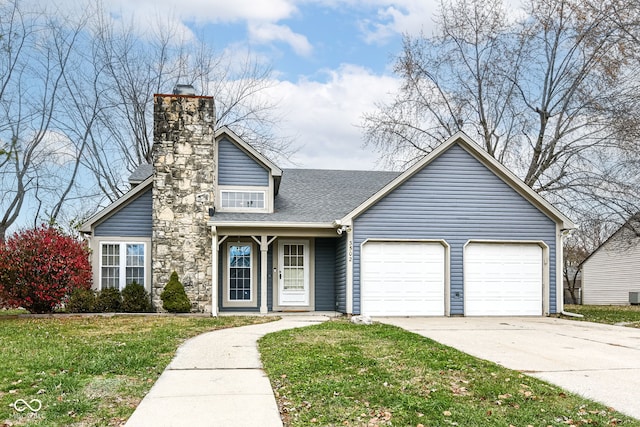 view of front of house featuring a front yard and a garage