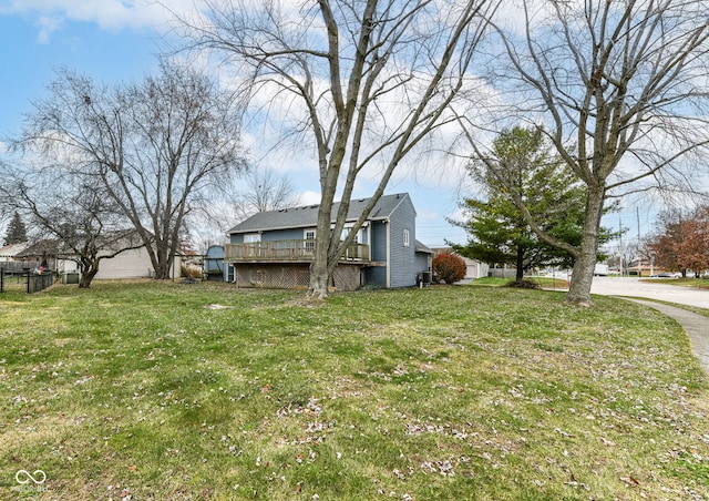 view of yard with a wooden deck