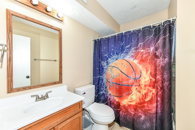 bathroom with vanity, toilet, a textured ceiling, and walk in shower