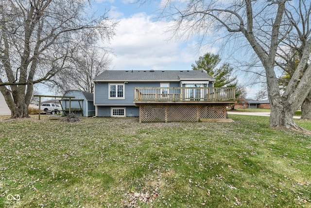 rear view of house with a yard and a deck