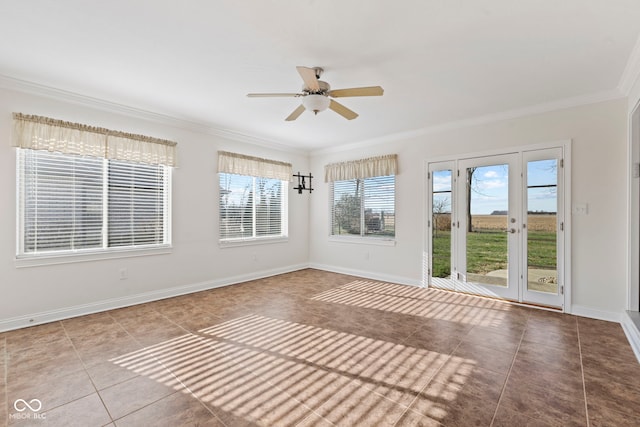 unfurnished sunroom featuring ceiling fan