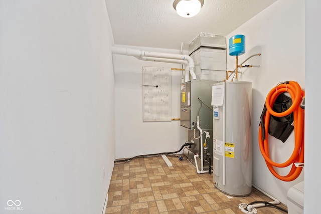 utility room featuring water heater