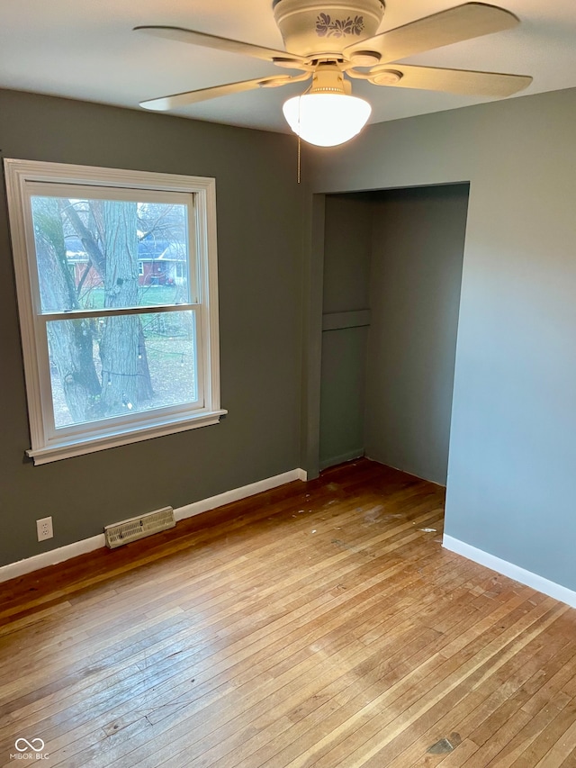 unfurnished bedroom with ceiling fan and light hardwood / wood-style floors