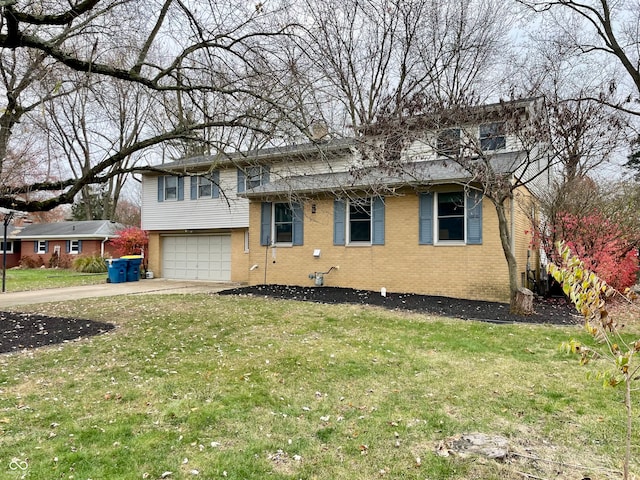 view of front of house with a front lawn and a garage