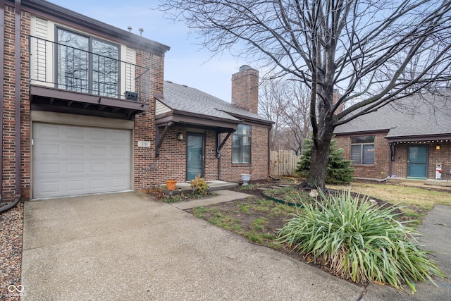 view of front of home with a balcony and a garage