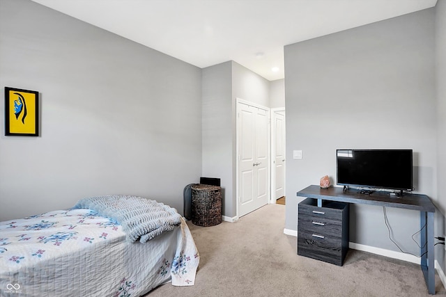 carpeted bedroom with a closet