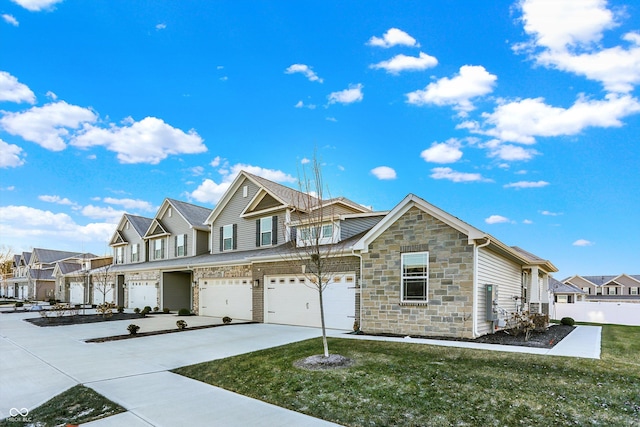 view of front of property with a garage and a front yard