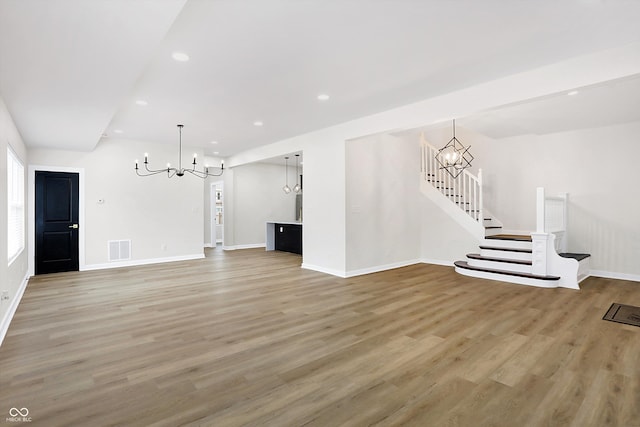 unfurnished living room featuring hardwood / wood-style floors