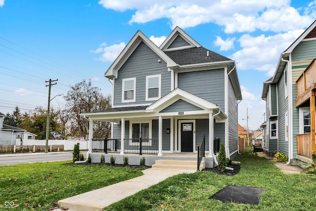 view of front facade featuring a front lawn and a porch