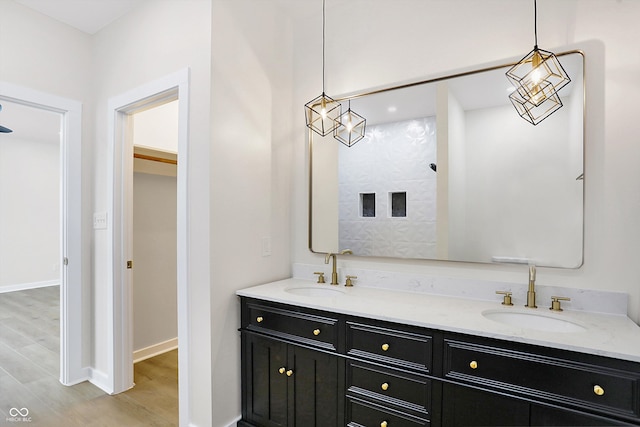 bathroom featuring vanity and wood-type flooring