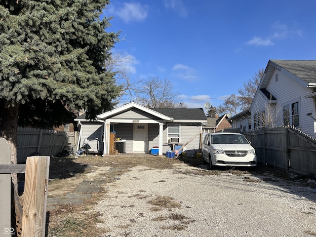 view of front of property featuring fence