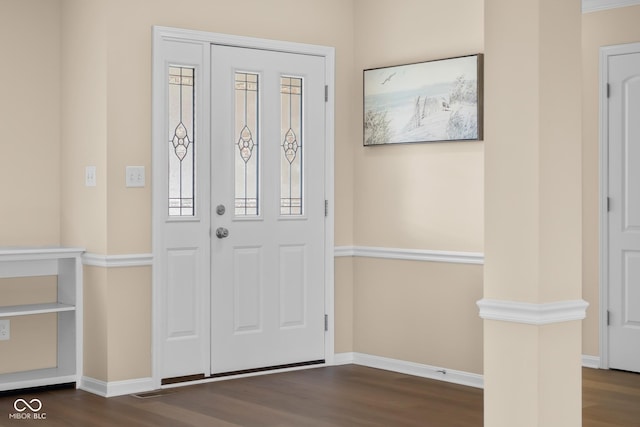 foyer with dark hardwood / wood-style floors