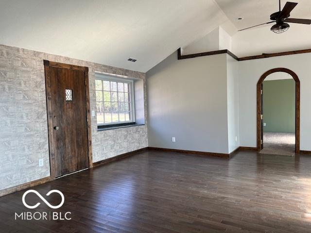 entryway featuring ceiling fan, dark hardwood / wood-style flooring, and vaulted ceiling