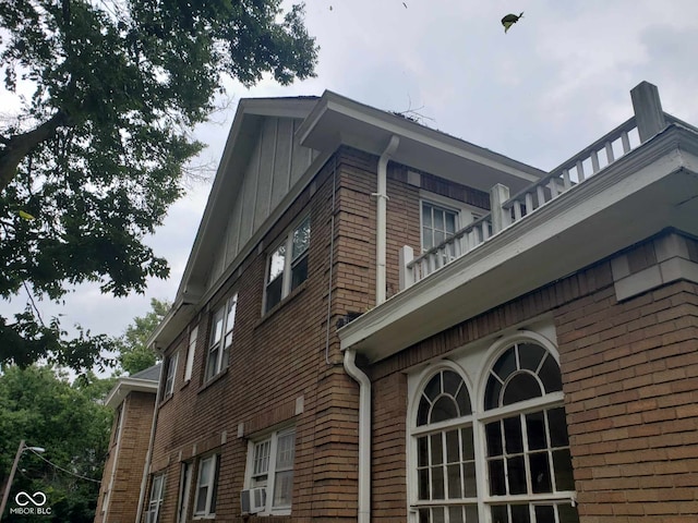 view of home's exterior with a balcony