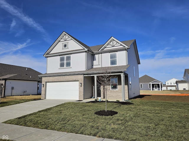 view of front of home featuring a garage and a front lawn