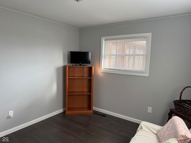 unfurnished room featuring dark hardwood / wood-style flooring